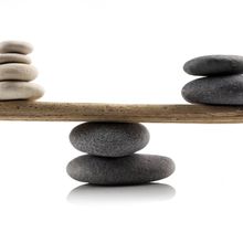 Grey and white stones on a wooden plank