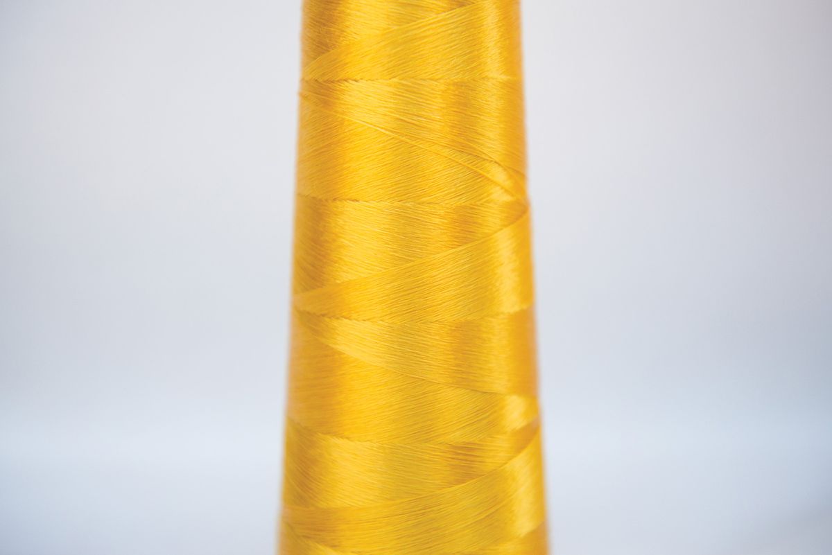 Spools of yellow Microsilk fibers.