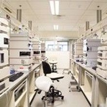 Research laboratory, no people, clean white, horizontal