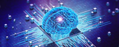 A digitized human brain in blue sits on top of a computer microchip