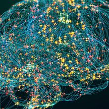 A depiction of a human brain in blue lines and yellow and red dots.