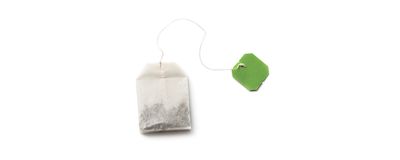 teabag with green tag on a white background