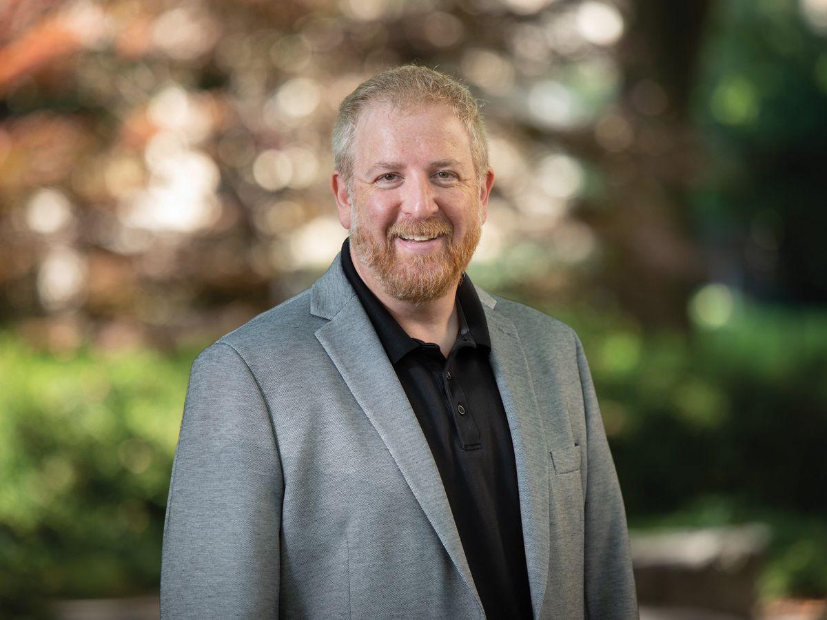 Seth Bordenstein, a biologist at Pennsylvania State University, has been studying Wolbachia for more than 25 years. He wears a gray jacket and black shirt.